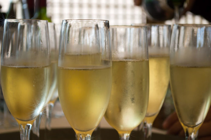 32565555 - closeup of a champagne glasses on a tray